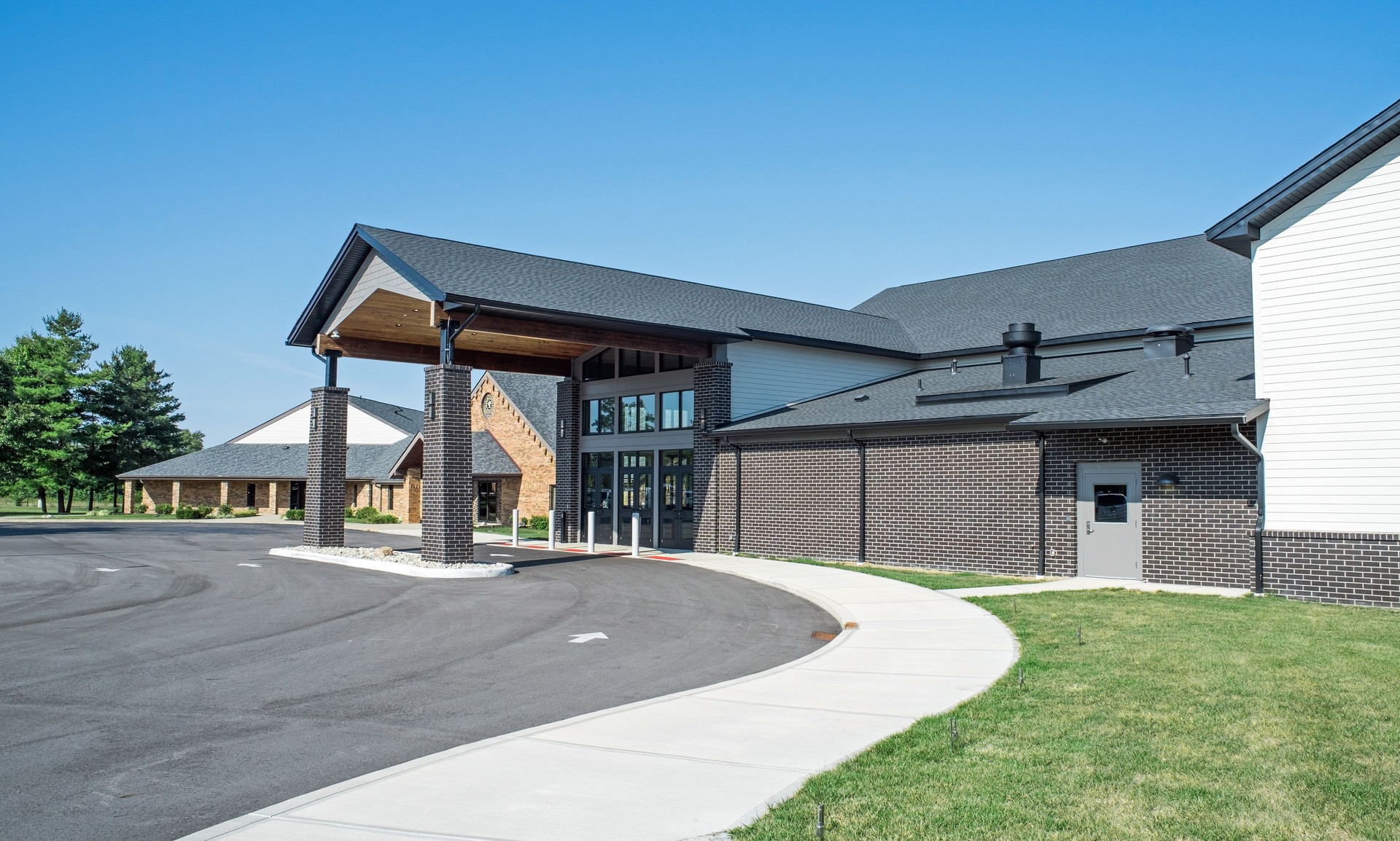 Curved Drive-thru of Modern Brick Church Entrance